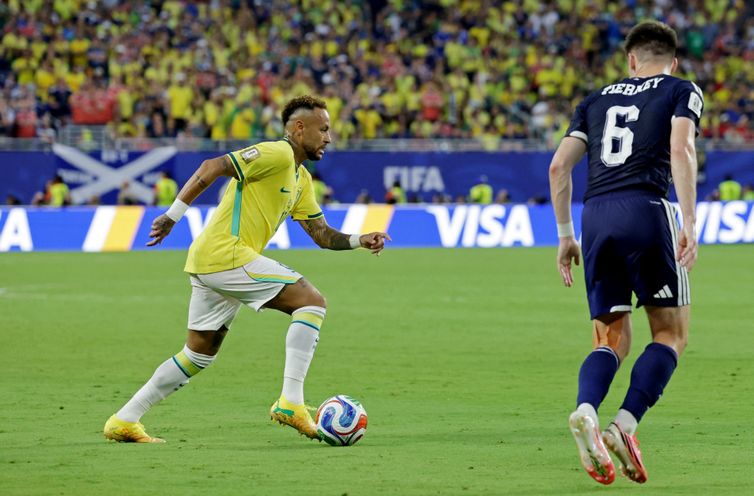 Soccer Football - FIFA World Cup 2026 - Group C - Scotland v Brazil - Miami Stadium, Miami Gardens, Florida, U.S. - June 24, 2026 Brazil's Neymar Jr. in action with Scotland's Kieran Tierney REUTERS/Amanda Perobelli