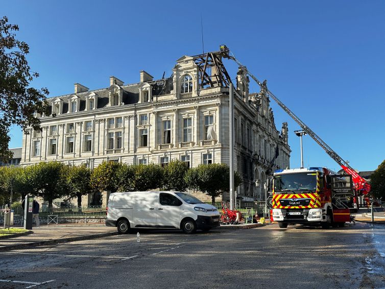 A firefighting truck next to the burnt and destroyed Limoges town hall, which was set ablaze and largely destroyed in an arson attack amid demonstrations against the cost of living and rising fuel prices, in Limoges, France, October 18, 2026. Picture taken by mobile phone. REUTERS/Clotaire Achi